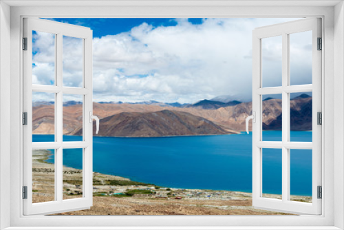 Fototapeta Naklejka Na Ścianę Okno 3D - Ladakh, India - Aug 08 2019 - Pangong Lake view from Spangmik Village in Ladakh, Jammu and Kashmir, India. The Lake is an endorheic lake in the Himalayas situated at a height of about 4350m.