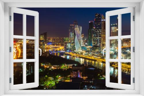 Fototapeta Naklejka Na Ścianę Okno 3D - Moscow City. Russia. Area with skyscrapers. Tours of Moscow at night. Skyscrapers on the river bank. Night illumination of the city. Tall buildings. Vacation in Russia. Architecture. Sights.