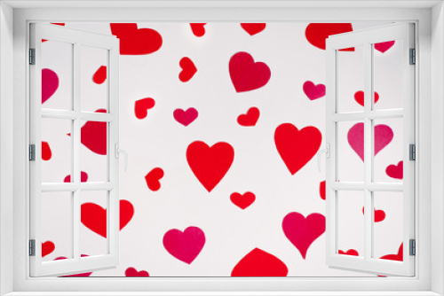 Background of red and pink hearts on white background. Valentine's day love holiday. Holiday card