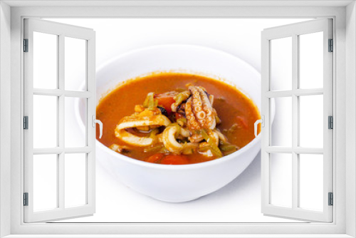 Fototapeta Naklejka Na Ścianę Okno 3D - soup with octopus in a plate on a white background