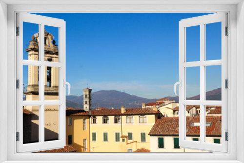 View to the roofs of Prato old town with tuscany mountains on the background, Italy