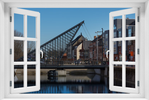 Fototapeta Naklejka Na Ścianę Okno 3D - Dendermonde, Belgium - February 24: Vlasmarktbrug, a rocking triangle bridge over the Old Dender river