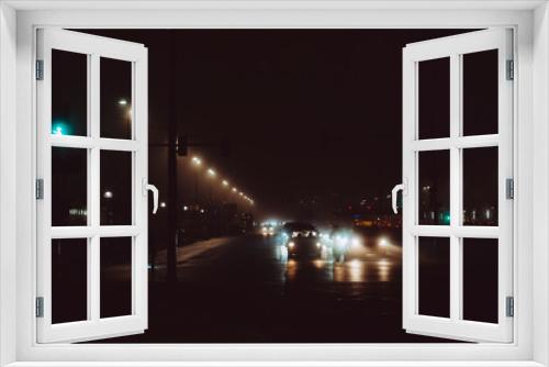 Fototapeta Naklejka Na Ścianę Okno 3D - Car light in foggy Berlin night