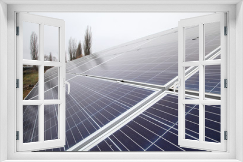 Fototapeta Naklejka Na Ścianę Okno 3D - Sunlight gleams off solar panel. Solar panel produces green, environmentally friendly energy from the sun.