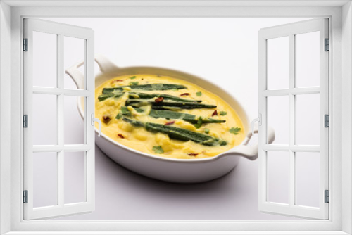 Fototapeta Naklejka Na Ścianę Okno 3D - Dahi Bhindi or Okra in Yogurt Gravy, served in a bowl or karahi, selective focus