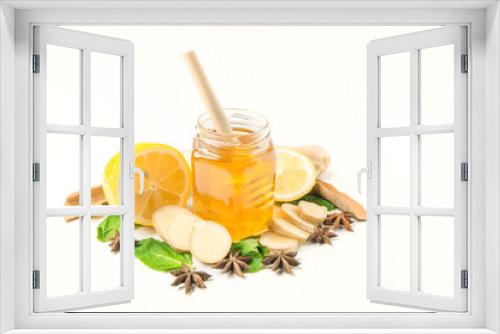 Fototapeta Naklejka Na Ścianę Okno 3D - Glass jar of honey and dipper with ginger, mint, carnation, cinnamon and lemon isolated on a white background with space for text 