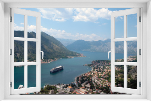 Fototapeta Naklejka Na Ścianę Okno 3D - Landscape from the mountains to the bay in the Adriatic Sea. Panorama of the old town on the shore with a cruise ship at sea.