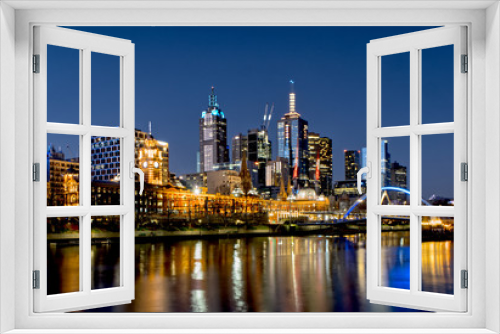 Fototapeta Naklejka Na Ścianę Okno 3D - A view of Melbourne city viewed from Southbank precinct just after dusk