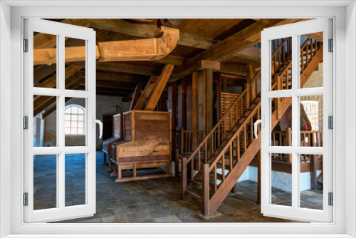 Fototapeta Naklejka Na Ścianę Okno 3D - Interior of traditional mill with wooden equipment