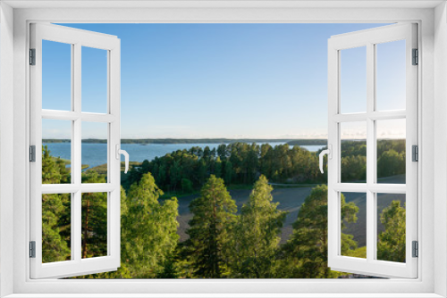 Fototapeta Naklejka Na Ścianę Okno 3D - Beautiful panorama view of blue sky, sea and green trees in forest during sunset.