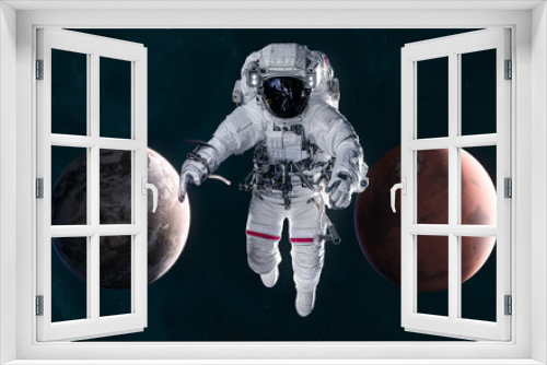 Fototapeta Naklejka Na Ścianę Okno 3D - Astronaut on background of Mars and Earth. Solar system. 3D Render. Science fiction. Elements of this image furnished by NASA