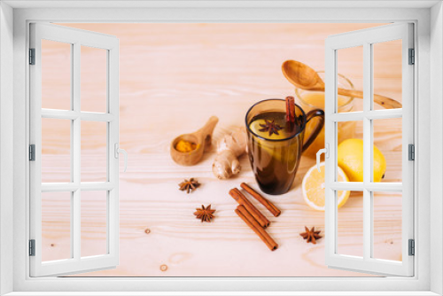 Fototapeta Naklejka Na Ścianę Okno 3D - Cup warm water with lemon, honey, ginger, cinnamon and anise.
