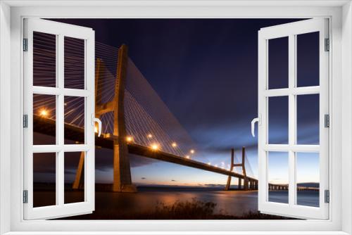 Fototapeta Naklejka Na Ścianę Okno 3D - bridge Vasco da Gama in Lisboa, Portugal to the sunrise