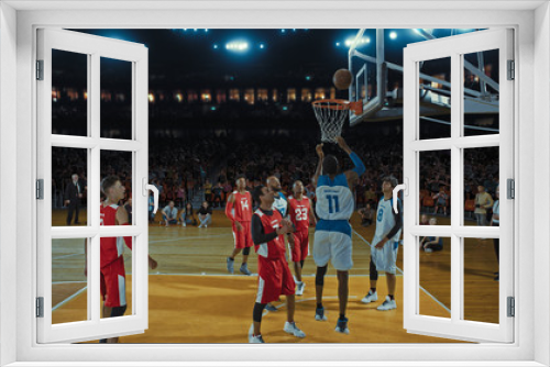 Basketball players on big professional arena during the game. Tense moment of the game. Celebration