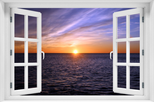 Fototapeta Naklejka Na Ścianę Okno 3D - Sunrise at the sea with blue cloudy sky