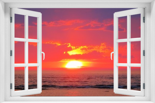 Fototapeta Naklejka Na Ścianę Okno 3D - Bright orange color sunset light on sea and clouds over horizon