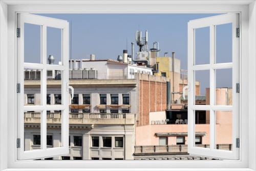 Fototapeta Naklejka Na Ścianę Okno 3D - Sunny View across Buildings with Rooftop Services & Aerials 