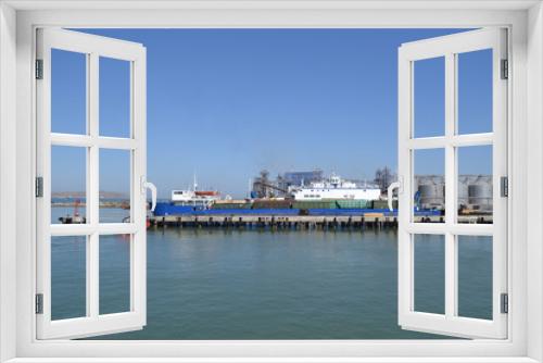Fototapeta Naklejka Na Ścianę Okno 3D - View of the cargo ferry in the Black Sea. Clear sunny day, blue sky.
