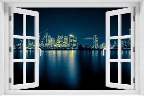 Fototapeta Naklejka Na Ścianę Okno 3D - Night Time Skyline View of Modern Business District Canary Wharf in London
