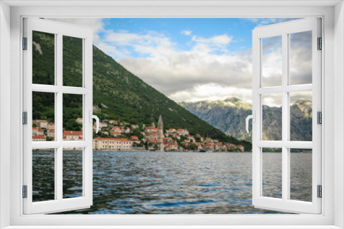 Fototapeta Naklejka Na Ścianę Okno 3D - panoramic view from the ship to Perast, Kotor bay and the surrounding mountains, blue sky with white clouds, Montenegro