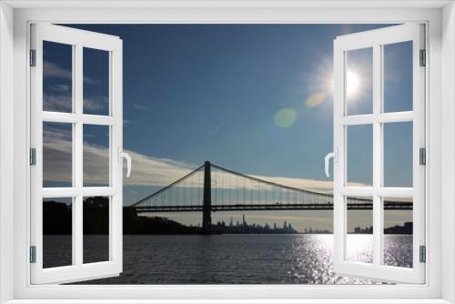 Fototapeta Naklejka Na Ścianę Okno 3D - George Washington Bridge and Manhattan skyline in backlit view down the Hudson River