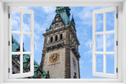 Neo-renaissance Rathaus clock tower facade at Rathausmarkt in Hamburg city hall