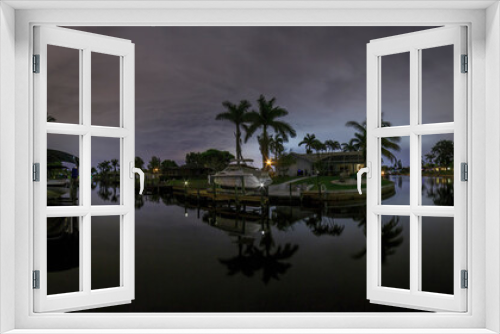 Fototapeta Naklejka Na Ścianę Okno 3D - Panoramic picture of Cape Coral water channels at night in spring
