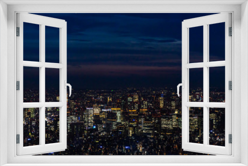 Fototapeta Naklejka Na Ścianę Okno 3D - Panoramic view of Tokyo from Skytree tv tower observation deck with skyscrapers illuminated at night, Japan