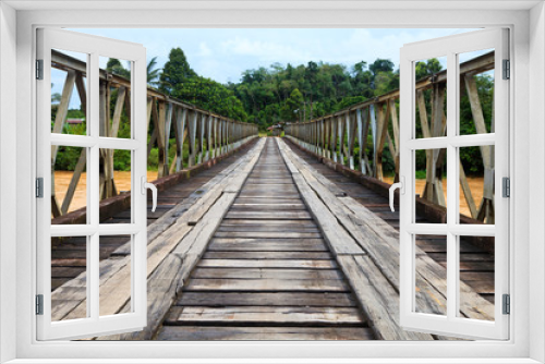 Fototapeta Naklejka Na Ścianę Okno 3D - Old bridge over a brown river
