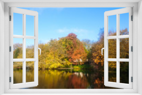 Fototapeta Naklejka Na Ścianę Okno 3D - Reflection of Autumn and Fall Colored Trees in Lake Water