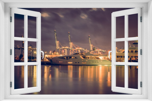 Fototapeta Naklejka Na Ścianę Okno 3D - miami harbor sea night cargo boats water sky clouds cranes industrial alubrado