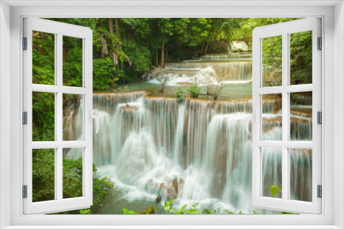 Fototapeta Naklejka Na Ścianę Okno 3D - Breathtaking waterfall at deep forest, Tropical rain forest or evergreen forest with waterfall, Erawan waterfall located Kanchanaburi Province, Thailand