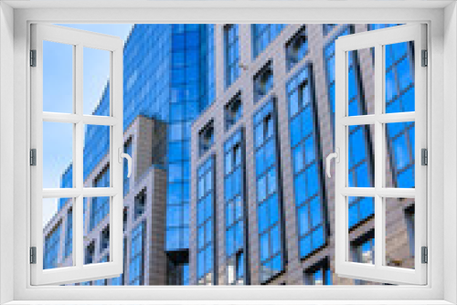 Fototapeta Naklejka Na Ścianę Okno 3D - View on a new multistory high rise office building