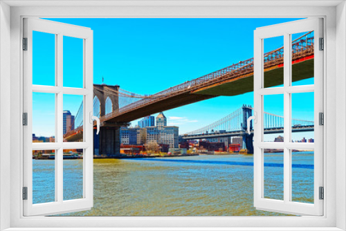 Fototapeta Naklejka Na Ścianę Okno 3D - Manhattan and Brooklyn bridge across East River, New York, USA. It is among the oldest in the United States of America. NYC, US. Skyline and cityscape. American construction