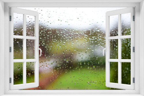 Fototapeta Naklejka Na Ścianę Okno 3D - Raindrops on the window. The view from the window on the park during the rain.