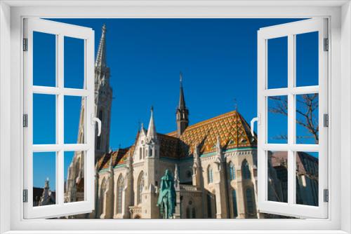 Fototapeta Naklejka Na Ścianę Okno 3D - View of Matthias church in Buda Castle district on blue sky, built at the heart of Buda's Castle District, Budapest, Hungary 