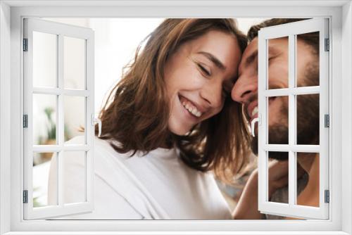 Loving couple indoors at home posing hugging.