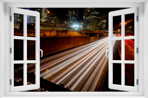 Fototapeta Naklejka Na Ścianę Okno 3D - long exposure of traffic taken on an overpass at night