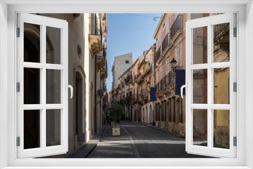Fototapeta Naklejka Na Ścianę Okno 3D - Picturesque street in Ortigia, Siracusa old town, Sicily, southern Italy
