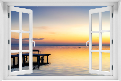 Fototapeta Naklejka Na Ścianę Okno 3D - Jetty on lake neusiedlersee in burgenland at sunset