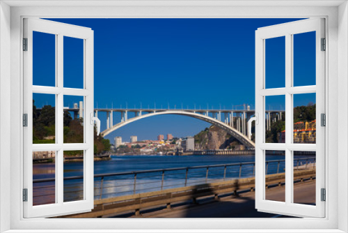 Fototapeta Naklejka Na Ścianę Okno 3D - View of the Douro River and the Arrabida Bridge in a beautiful early spring day at Porto City in Portugal
