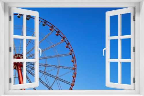 Fototapeta Naklejka Na Ścianę Okno 3D - Part of ferris wheel with blue sky background