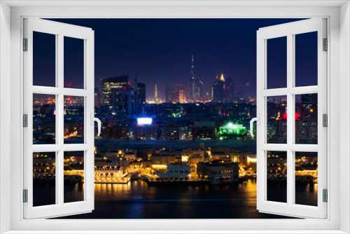 Fototapeta Naklejka Na Ścianę Okno 3D - Panoramic view of Dubai cityscape and the Dubai creek at night