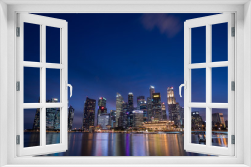 Fototapeta Naklejka Na Ścianę Okno 3D - Singapore skyscrapers at magic hour