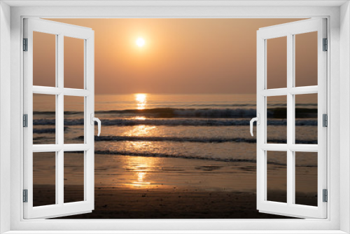 Fototapeta Naklejka Na Ścianę Okno 3D - Nature background of seashore beach wave and coastline sand with sunset on water surface for holiday relaxation lifestyle concept