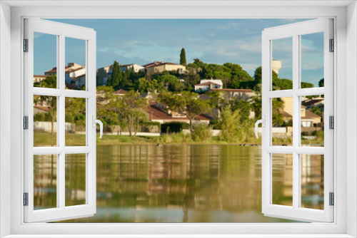 Fototapeta Naklejka Na Ścianę Okno 3D - homes mirroring in a lake