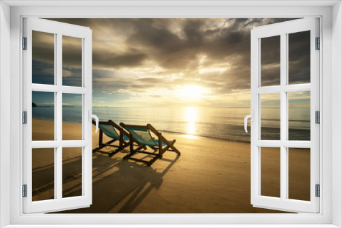 Fototapeta Naklejka Na Ścianę Okno 3D - Two Beach Chairs standing in beach with beautiful sea and sunlight in background at island in Phuket, Thailand. Summer, Travel, Vacation and Holiday concept.