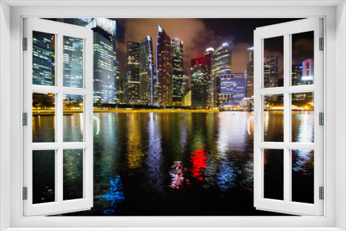 Fototapeta Naklejka Na Ścianę Okno 3D - Skyline in business district Singapore at night time.