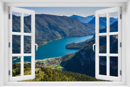 Fototapeta Naklejka Na Ścianę Okno 3D - Aerial view over the beautiful Molveno town and Molveno lake, an alpine lake in Trentino, Italy
