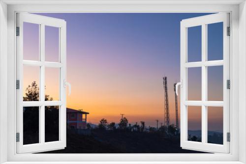 Fototapeta Naklejka Na Ścianę Okno 3D - Telecommunication tower on top of the mountain with colorful sky at sunrise or sunset time.